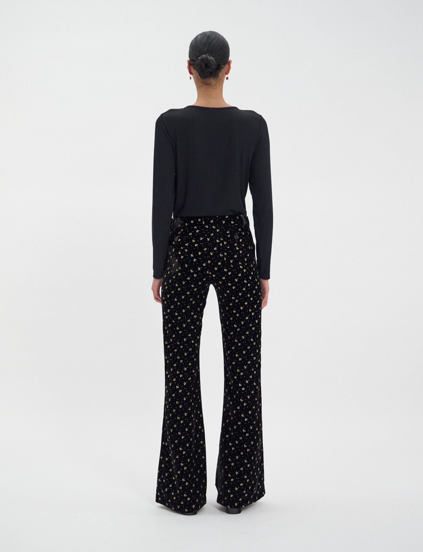 Pantalone Charlotte di terciopelo nero liso con stampa dorata
