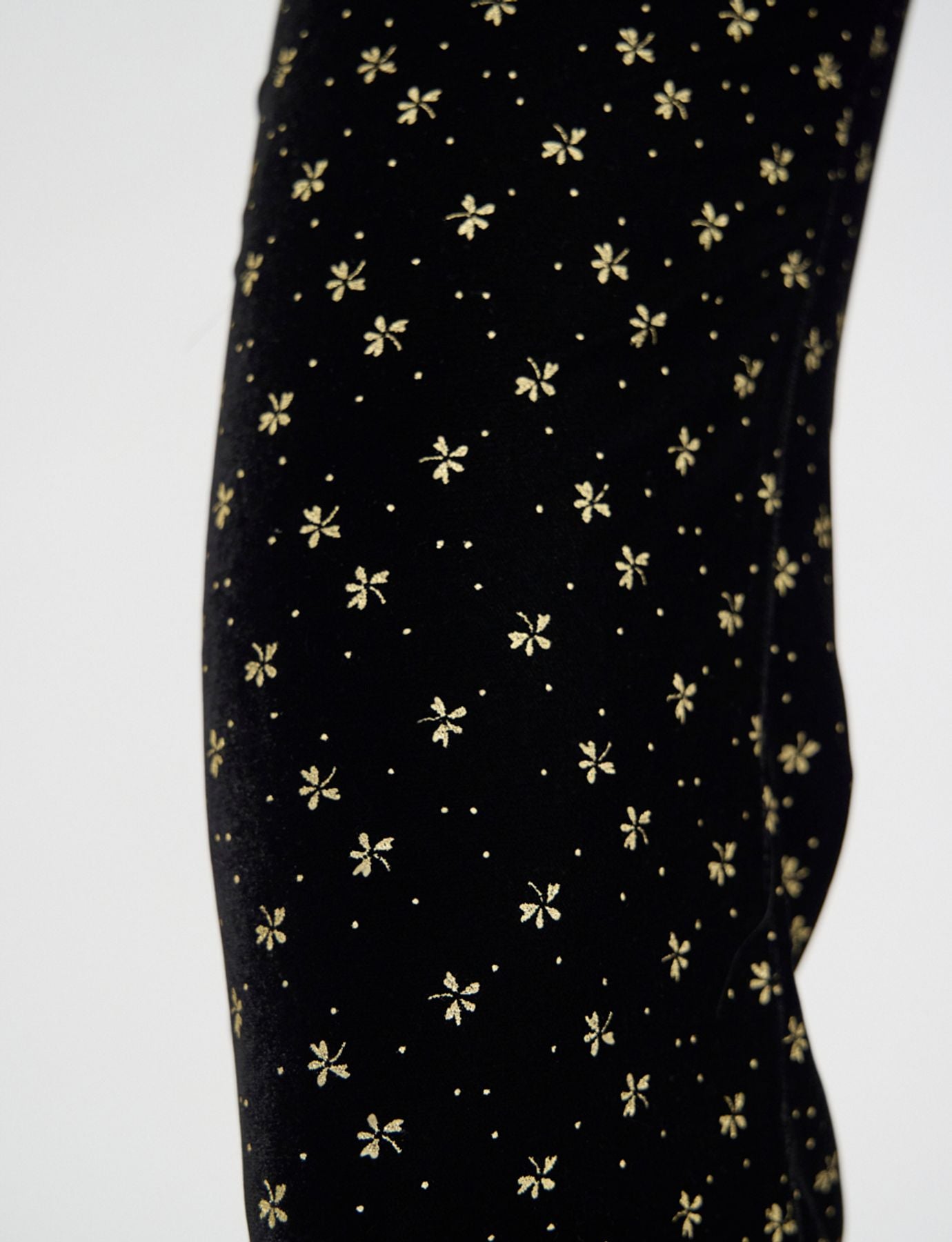 Pantalone Charlotte di terciopelo nero liso con stampa dorata